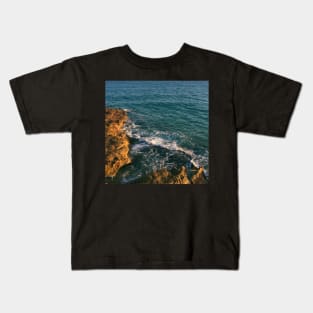 Blue sea waves of playa arrabassada Spain Kids T-Shirt